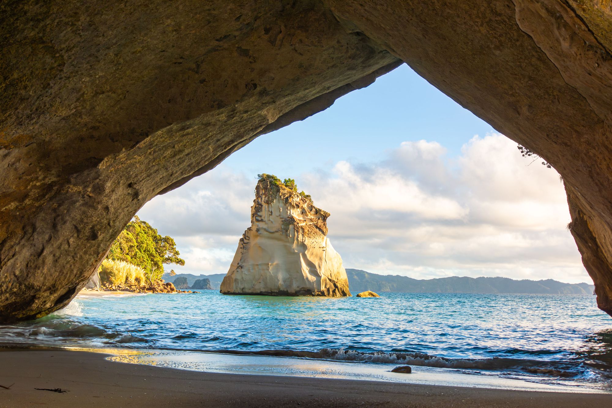 Looking through the arch at Cathedral Cove to Te Hoho rock