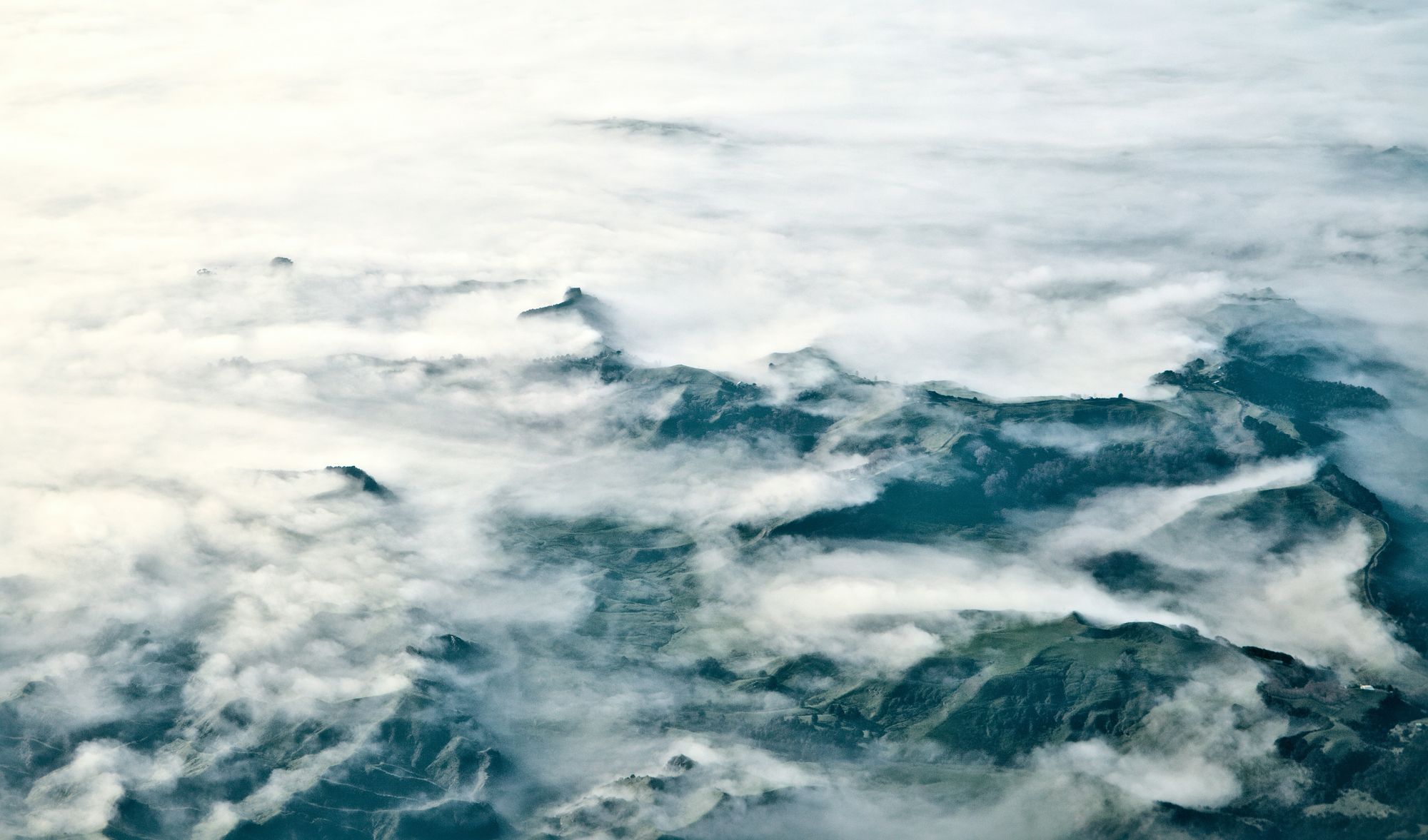 Aerial view of morning fog over the green Waikato hills
